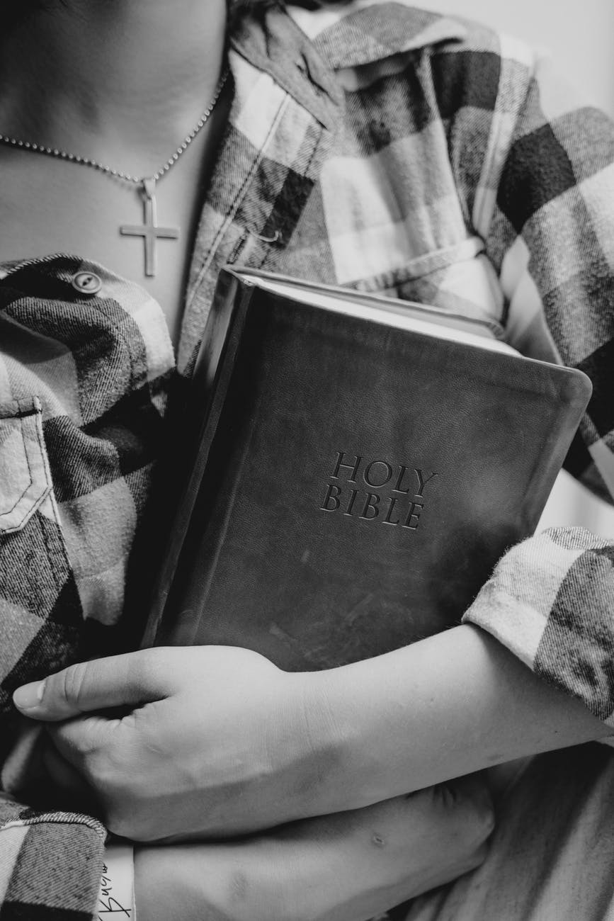 A girl holding Bible