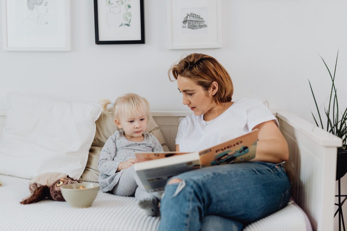 Women reading Bible to a child